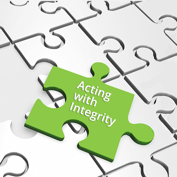 2Lift's code of conduct. Picture of a piece of a jigsaw puzzle with the text "Acting with integrity" written on it.