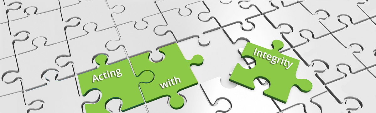 2Lift's code of conduct. Picture of a piece of a jigsaw puzzle with the text "Acting with integrity" written on it.