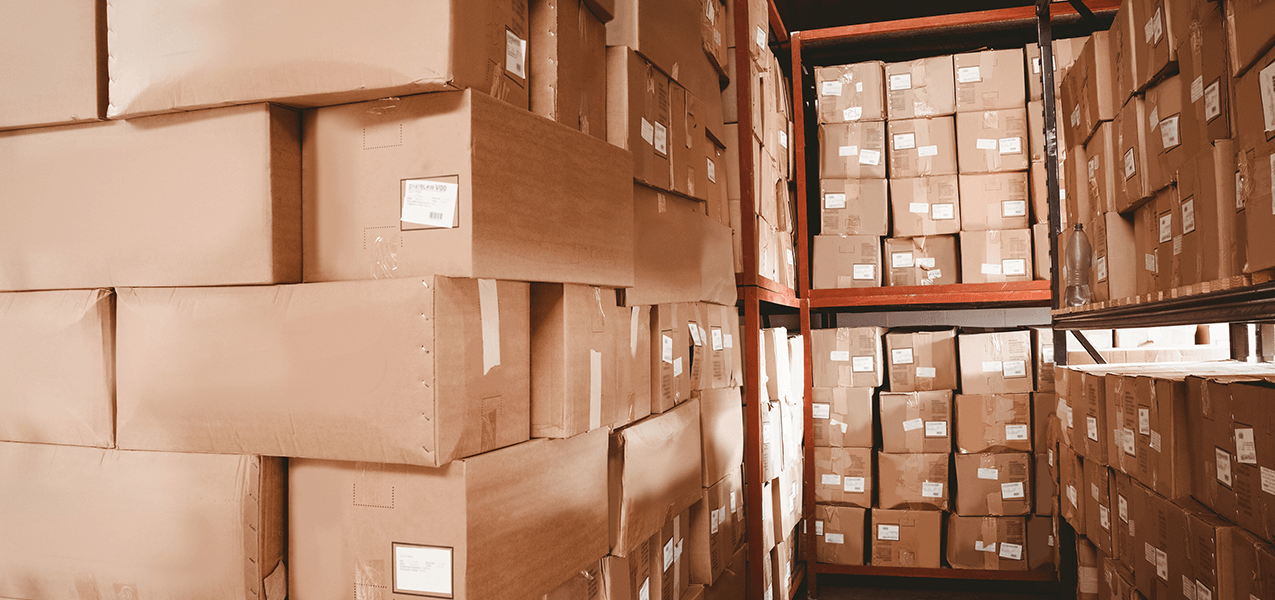 A storage facility filled with cardboard boxes.